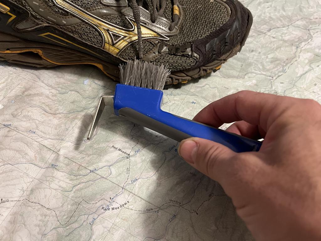 Cleaning a shoe with a hoof pick