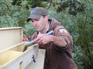 Nate Richardson (US Fish and Wildlife Service) calibrating the seed drill