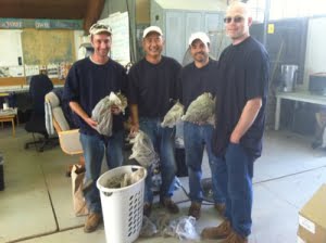 Adults in custody showing their harvest of Kincaid's lupine seeds.